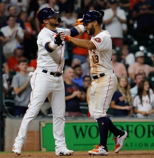 Abraham Toro of the Houston Astros is congratulated by Yuli Gurriel after hitting a home run in the seventh inning against the Chicago White Sox at...
