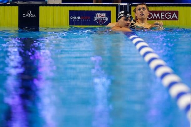 Michael Andrew and Carson Foster of the United States react after competing in a semifinal heat for the Men's 200m individual medley during Day Five...