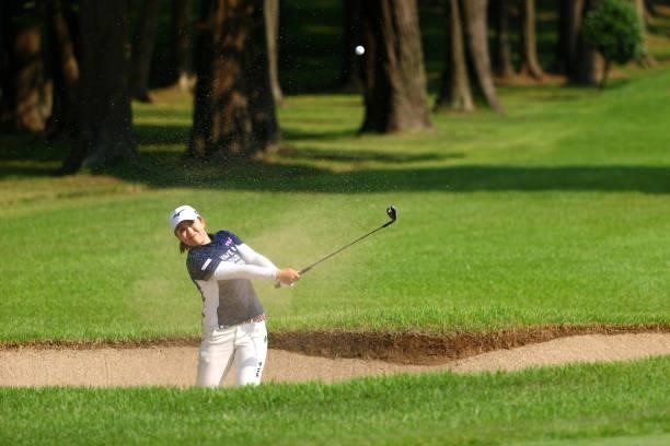 Mao Saigo of Japan hits out from a bunker on the 18th hole during the first round of Nichirei Ladies at Sodegaura Country Club Shinsode Course on...