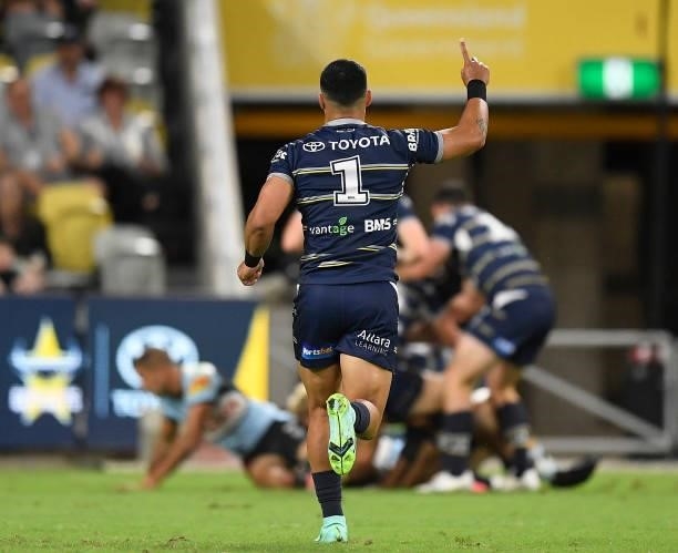 Valentine Holmes of the Cowboys celebrates the try of Francis Molo during the round 15 NRL match between the North Queensland Cowboys and the...