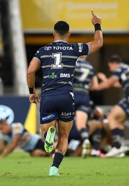 Valentine Holmes of the Cowboys celebrates the try of Francis Molo during the round 15 NRL match between the North Queensland Cowboys and the...