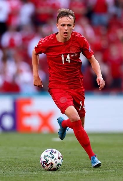 Mikkel Damsgaard of Denmark runs with the ball during the UEFA Euro 2020 Championship Group B match between Denmark and Belgium on June 17, 2021 in...