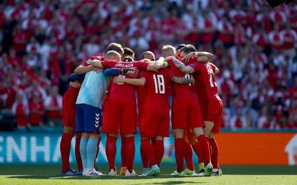 The team of Denmark lines up ahead of the UEFA Euro 2020 Championship Group B match between Denmark and Belgium on June 17, 2021 in Copenhagen,...