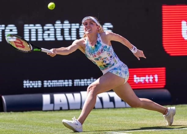 Ekaterina Alexandrova of Russia stretches to play a forehand against Belinda Bencic of Switzerland in the women's singles quarter final match during...