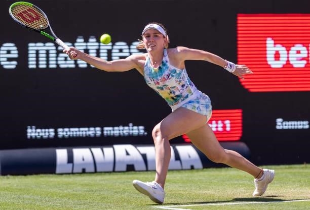 Ekaterina Alexandrova of Russia stretches to play a forehand against Belinda Bencic of Switzerland in the women's singles quarter final match during...