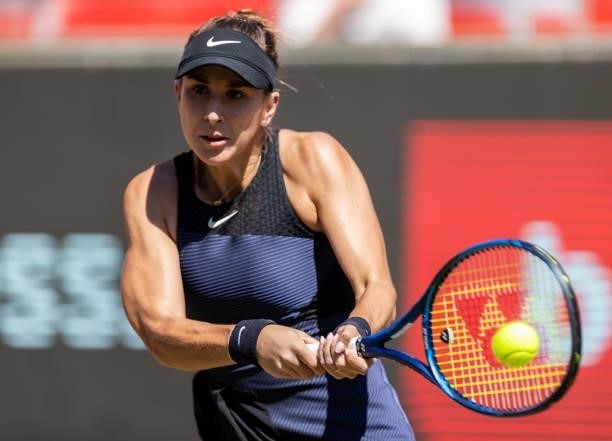 Belinda Bencic of Switzerland hits a backhand against Ekaterina Alexandrova of Russia in the women's singles quarter final match during day 7 of the...