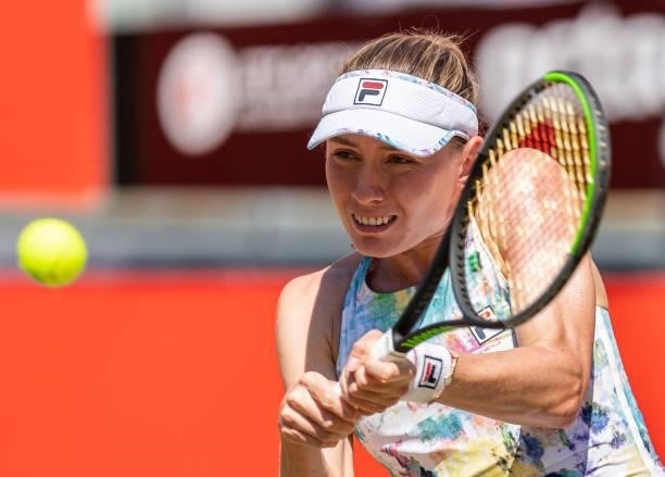 Ekaterina Alexandrova of Russia hits a backhand against Belinda Bencic of Switzerland in the women's singles quarter final match during day 7 of the...