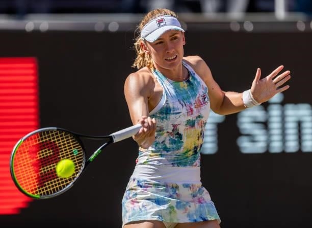 Ekaterina Alexandrova of Russia hits a forehand against Belinda Bencic of Switzerland in the women's singles quarter final match during day 7 of the...