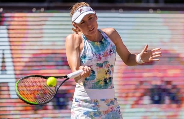 Ekaterina Alexandrova of Russia plays a forehand against Belinda Bencic of Switzerland in the women's singles quarter final match during day 7 of the...