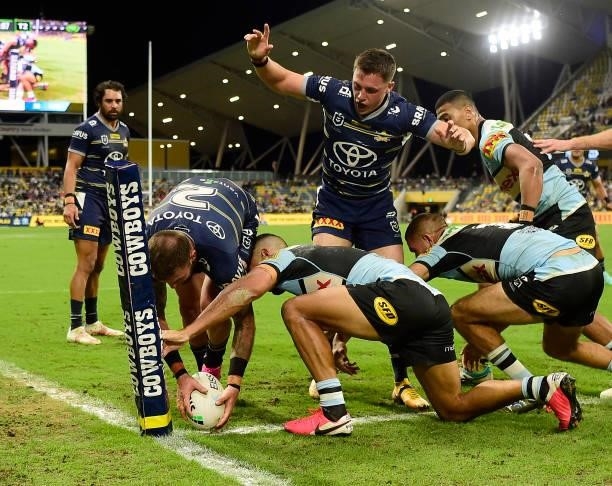 Kyle Feldt of the Cowboys scores a try during the round 15 NRL match between the North Queensland Cowboys and the Cronulla Sharks at QCB Stadium, on...