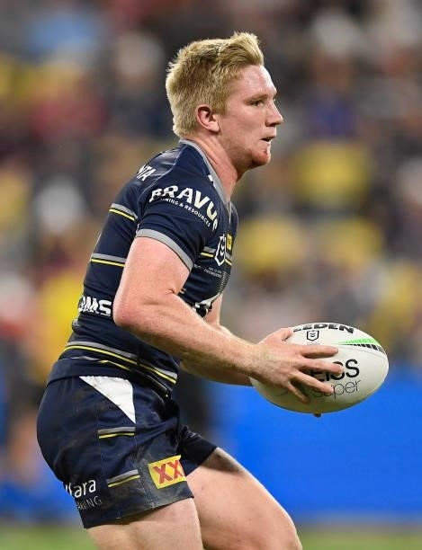 Tom Dearden of the Cowboys runs the ball during the round 15 NRL match between the North Queensland Cowboys and the Cronulla Sharks at QCB Stadium,...