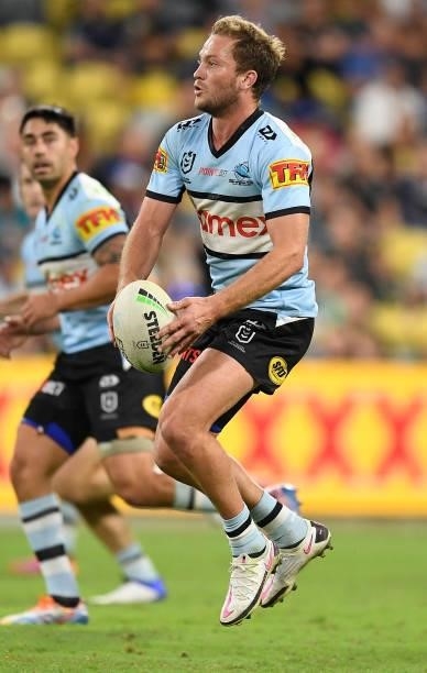 Matt Moylan of the Sharks runs the ball during the round 15 NRL match between the North Queensland Cowboys and the Cronulla Sharks at QCB Stadium, on...