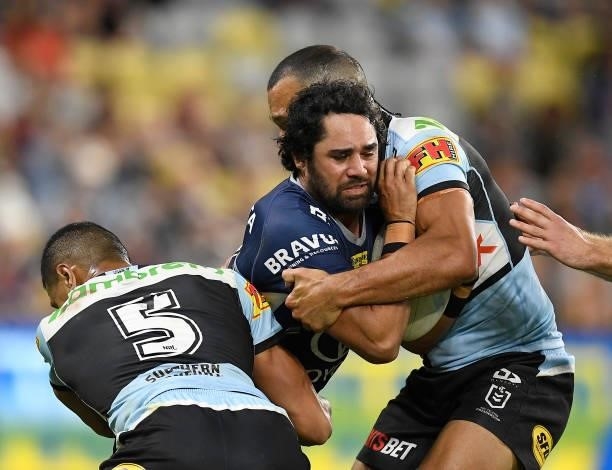 Javid Bowen of the Cowboys is tackled during the round 15 NRL match between the North Queensland Cowboys and the Cronulla Sharks at QCB Stadium, on...