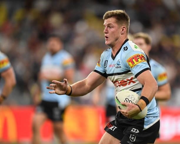 Teig Wilton of the Sharks runs the ball during the round 15 NRL match between the North Queensland Cowboys and the Cronulla Sharks at QCB Stadium, on...