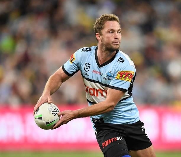 Matt Moylan of the Sharks passes the ball during the round 15 NRL match between the North Queensland Cowboys and the Cronulla Sharks at QCB Stadium,...