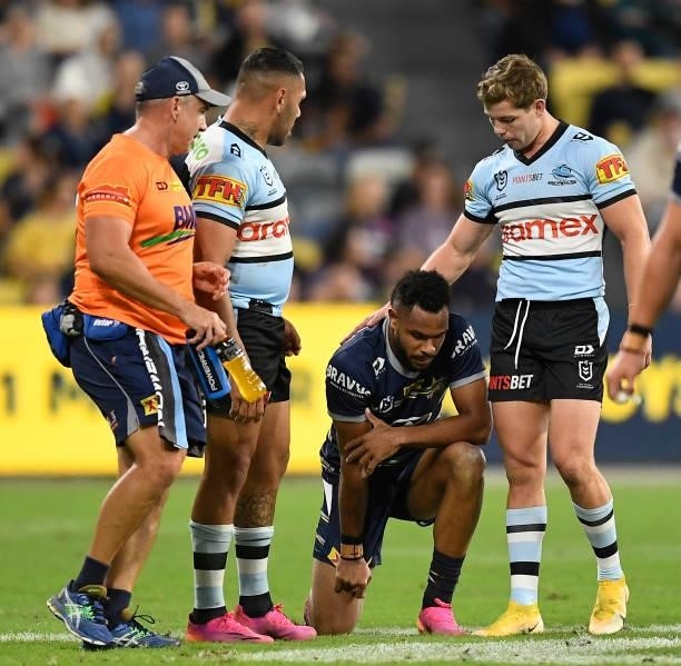 Hamiso Tabuai-Fidow of the Cowboys reacts after being injured during the round 15 NRL match between the North Queensland Cowboys and the Cronulla...