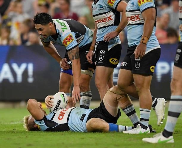 Aiden Tolman of the Sharks lays on the ground injured during the round 15 NRL match between the North Queensland Cowboys and the Cronulla Sharks at...