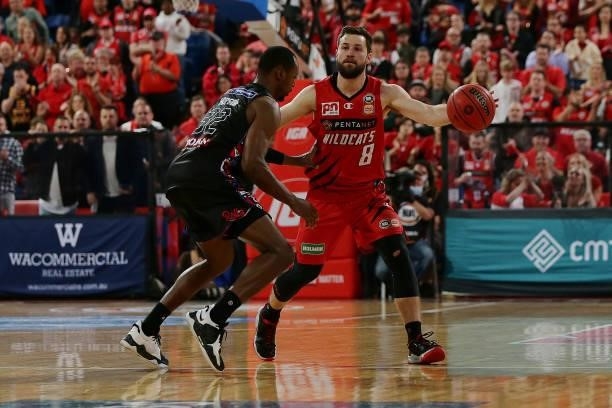 Mitchell Norton of the Wildcats gets around Scotty Hopson of Melbourne United during game one of the NBL Grand Final Series between the Perth...