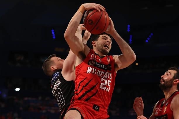 Corey Shervill of the Wildcats pulls in a rebound against Mitch McCarron of Melbourne United during game one of the NBL Grand Final Series between...