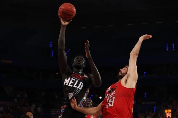 Jo Lual-Acuil of Melbourne United goes to the basket against John Mooney of the Wildcats during game one of the NBL Grand Final Series between the...