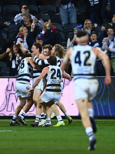 Gary Rohan of the Cats is congratulated by team mates after kicking a goal to win the match during the round 13 AFL match between the Geelong Cats...