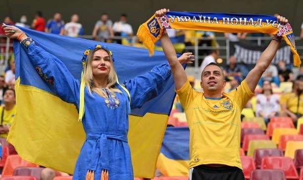 Ukraine fans cheer their team during the UEFA Euro 2020 Championship Group C match between Ukraine and North Macedonia at National Arena on June 17,...