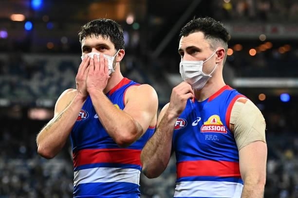 Bailey Williams and Toby McLean of the Bulldogs look dejected after losing the round 13 AFL match between the Geelong Cats and the Western Bulldogs...