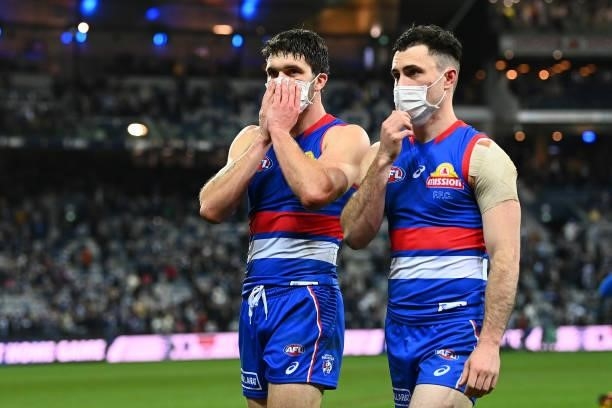 Bailey Williams and Toby McLean of the Bulldogs look dejected after losing the round 13 AFL match between the Geelong Cats and the Western Bulldogs...