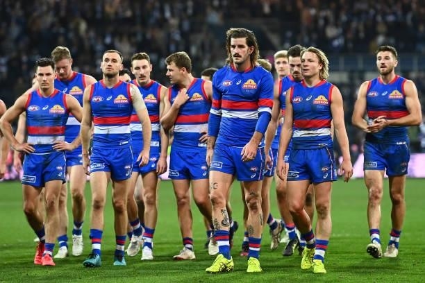The Bulldogs look dejected after losing the round 13 AFL match between the Geelong Cats and the Western Bulldogs at GMHBA Stadium on June 18, 2021 in...