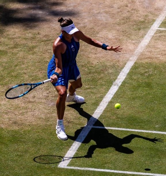 Garbine Muguruza of Spain hits a forehand against Alize Cornet of France in the women's singles quarter final match during during day 7 of the...