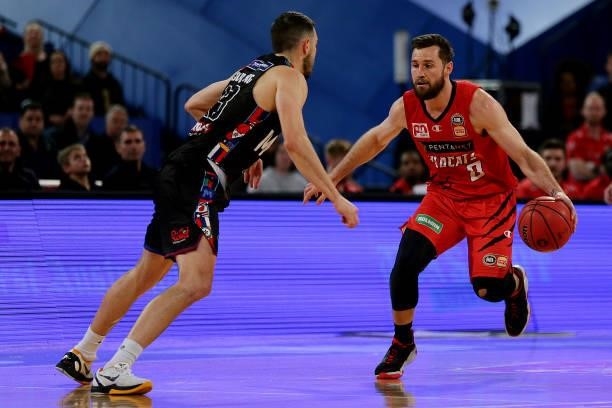 Mitchell Norton of the Wildcats tries to get past Chris Goulding of Melbourne United during game one of the NBL Grand Final Series between the Perth...