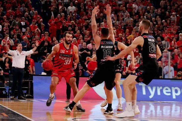 Mitch McCarron of Melbourne United blocks John Mooney of the Wildcats during game one of the NBL Grand Final Series between the Perth Wildcats and...