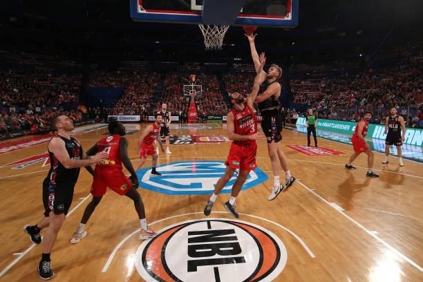 Jock Landale of Melbourne United goes to the basket against John Mooney of the Wildcats during game one of the NBL Grand Final Series between the...