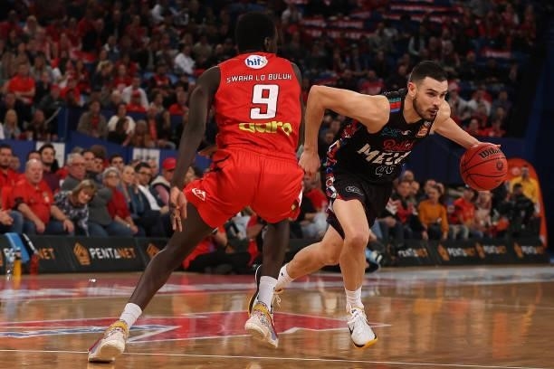 Chris Goulding of Melbourne United drives past Wani Swaka Lo Buluk of the Wildcats during game one of the NBL Grand Final Series between the Perth...