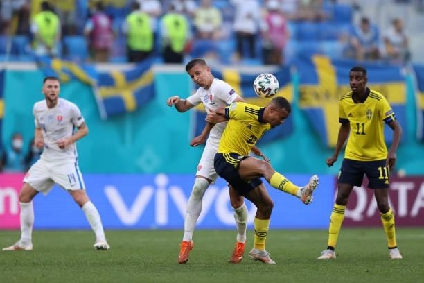 Robin Quaison of Sweden competes for a header with Lubomir Satka of Slovakia during the UEFA Euro 2020 Championship Group E match between Sweden and...