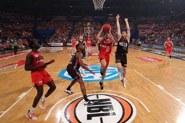 Todd Blanchfield of the Wildcats goes to the basket against Chris Goulding of Melbourne United during game one of the NBL Grand Final Series between...