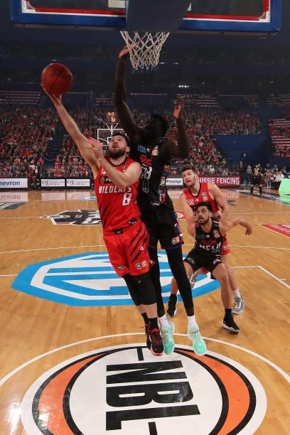 Mitchell Norton of the Wildcats goes to the basket against Jo Lual-Acuil of Melbourne United during game one of the NBL Grand Final Series between...