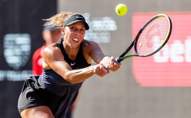 Madison Keys of the United States stretches to play a backhand against Liudmila Samsonova of Russia in the women's singles quarter final match during...