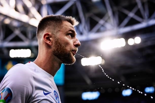 Milan Škriniar of Slovakia spits water during the UEFA Euro 2020 Championship Group E match between Sweden and Slovakia at Saint Petersburg Stadium...