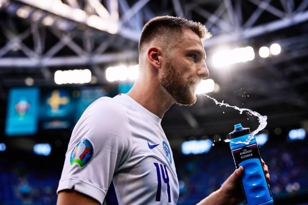 Milan Škriniar of Slovakia spits water during the UEFA Euro 2020 Championship Group E match between Sweden and Slovakia at Saint Petersburg Stadium...