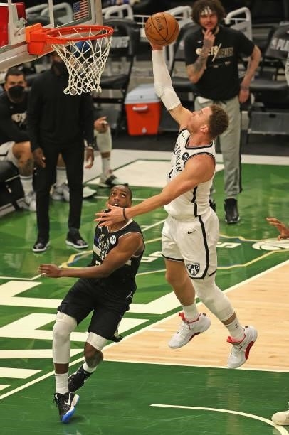 Blake Griffin of the Brooklyn Nets drives to the basket over Khris Middleton of the Milwaukee Bucks at Fiserv Forum on June 17, 2021 in Milwaukee,...