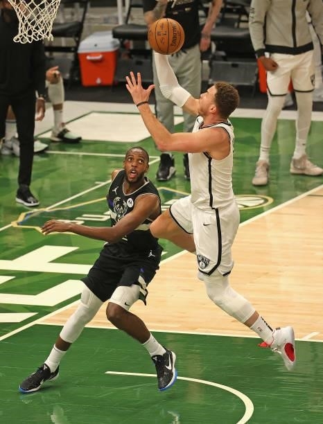Blake Griffin of the Brooklyn Nets drives to the basket over Khris Middleton of the Milwaukee Bucks at Fiserv Forum on June 17, 2021 in Milwaukee,...