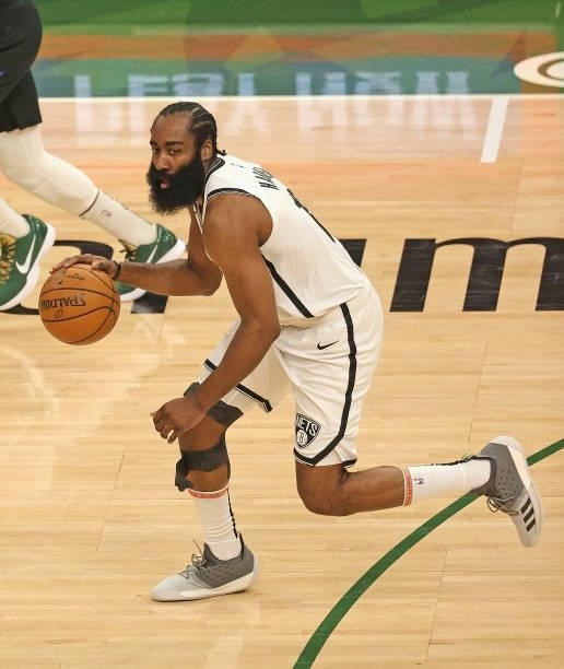 James Harden of the Brooklyn Nets brings the ball up the court against the Milwaukee Bucks at Fiserv Forum on June 17, 2021 in Milwaukee, Wisconsin....