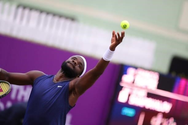 Frances Tiafoe of USA serves during his Quarter-final match against Denis Shapovalov of Canada during Day 5 of The cinch Championships at The Queen's...