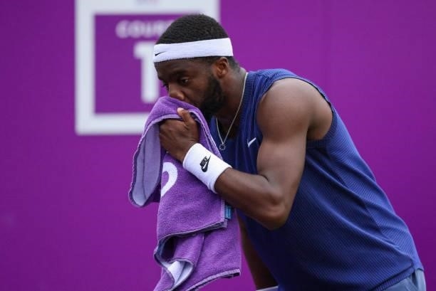Frances Tiafoe of USA wipes sweet from his face during his Quarter-final match against Denis Shapovalov of Canada during Day 5 of The cinch...