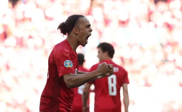 Yussuf Poulsen of Denmark celebrates after scoring the 1-0 goal during the UEFA Euro 2020 Championship Group B match between Denmark and Belgium at...