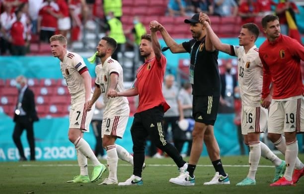 Belgian players celebrate after winning the UEFA Euro 2020 Championship Group B match between Denmark and Belgium at Parken Stadium on June 17, 2021...