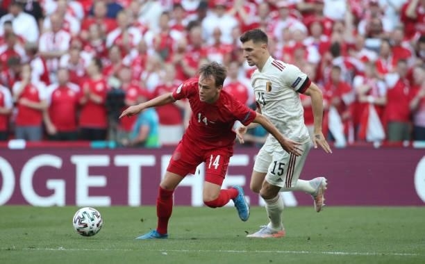 Mikkel Damsgaard of Denmark battles for the ball with Thomas Meunier of Belgium during the UEFA Euro 2020 Championship Group B match between Denmark...