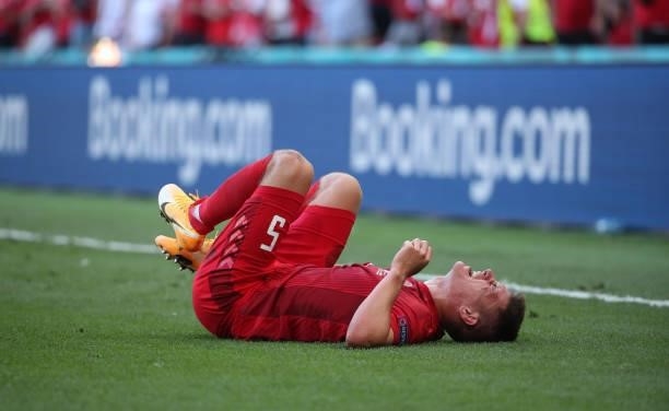 Joakim Maehle of Denmark lies on the ground during the UEFA Euro 2020 Championship Group B match between Denmark and Belgium at Parken Stadium on...