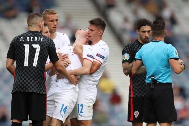 Jakub Jankto of Czech Republic appears to be injured as he is helped by team mate Lukas Masopust during the UEFA Euro 2020 Championship Group D match...